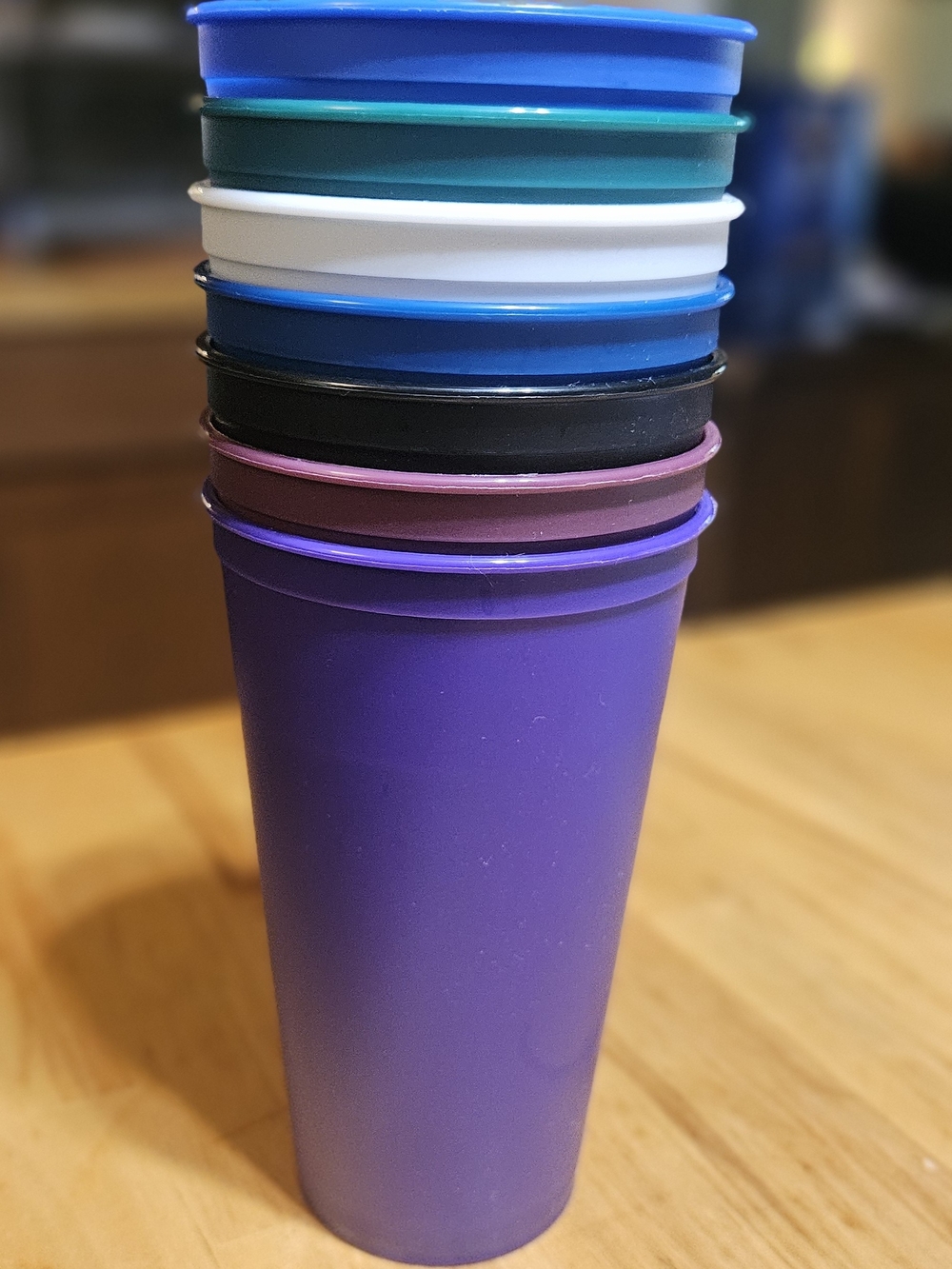 Stack of Colorful Plastic Cups - Purple Top